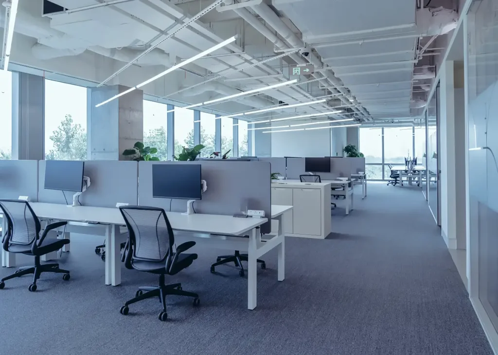 A modern office interior with rows of desks after a Commercial Renovation